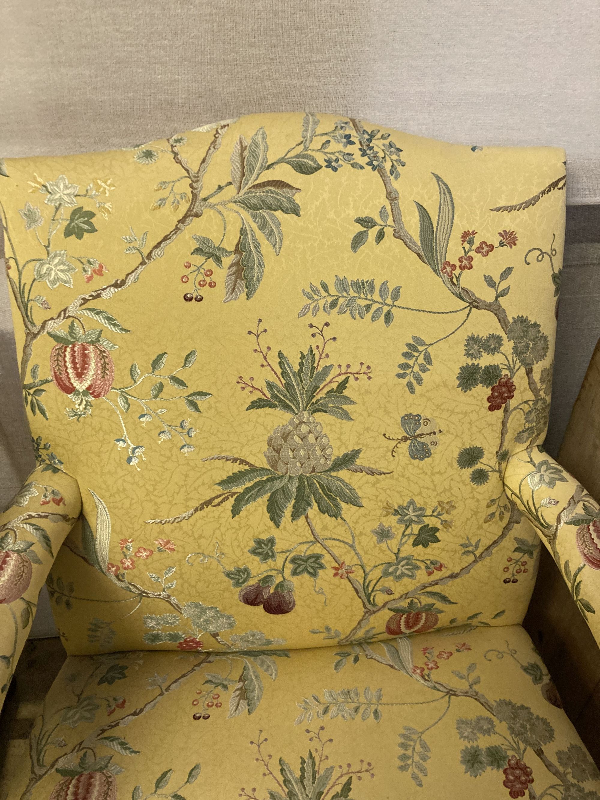 A George III style mahogany Gainsborough armchair, upholstered in a yellow ground fabric, width 68cm, depth 76cm, height 98cm